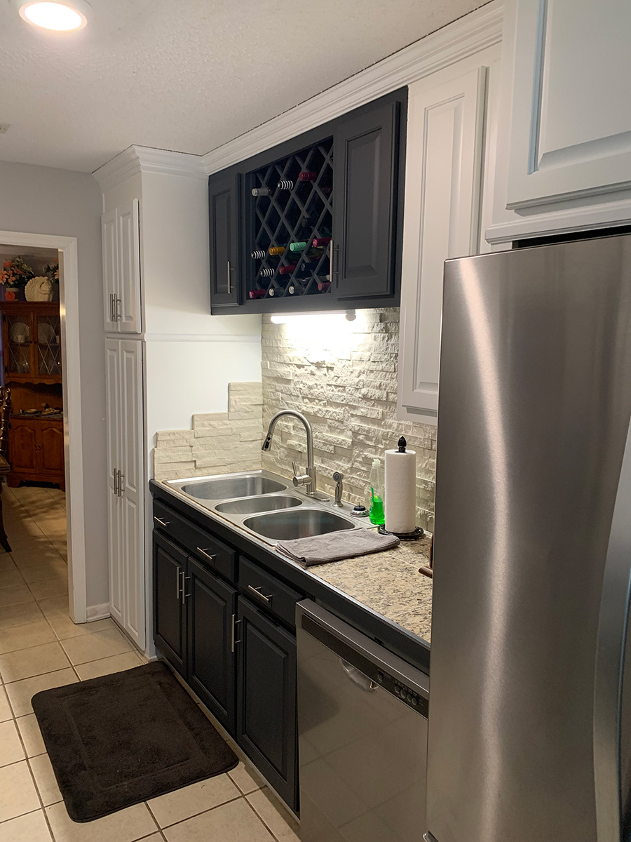 Kitchen remodel with stainless steel appliances.